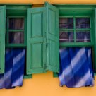 Windows with Blue Curtains